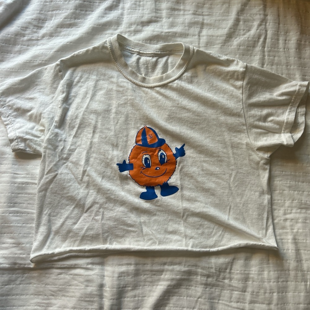 White Syracuse crop top with otto logo on the front and blue and orange star